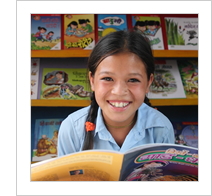 girl reading in a  library in Nepal